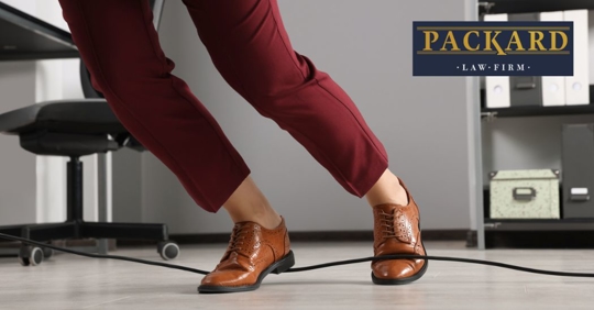 someone tripping over a wire in an office