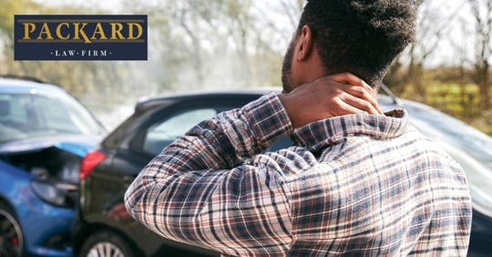 car accident victim holding his neck